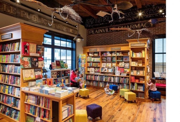 There is a spacious book nook with tot-sized stools for the littlest readers. Photo by Warren Jagger Photography courtesy of Bergmeyer Design