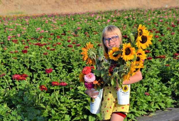 Flowers always bring smiles to little faces!