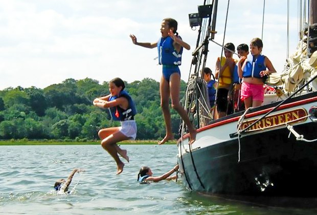 Take the wheel aboard the former oyster sloop Christeen in Oyster Bay. Photo courtesy of The WaterFront Center