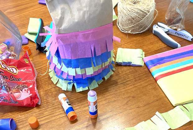 It's easier than you'd think to turn a simple paper lunch bag into a festive piñata!