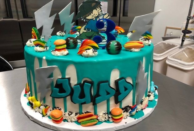 At Armonk's Sugar Hi, specialty cakes include a brightly-colored ganache drip with candy pieces. Photo courtesy of Sugar Hi