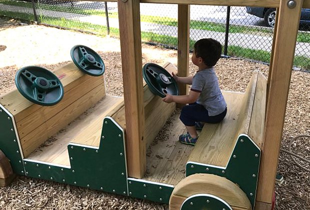Little ones can take the wheel(s) of the wooden car at Sunset Park.