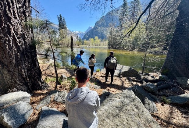 Take a break along the Merced River as you hike along the Valley Loop Trail in Yosemite National Park. 