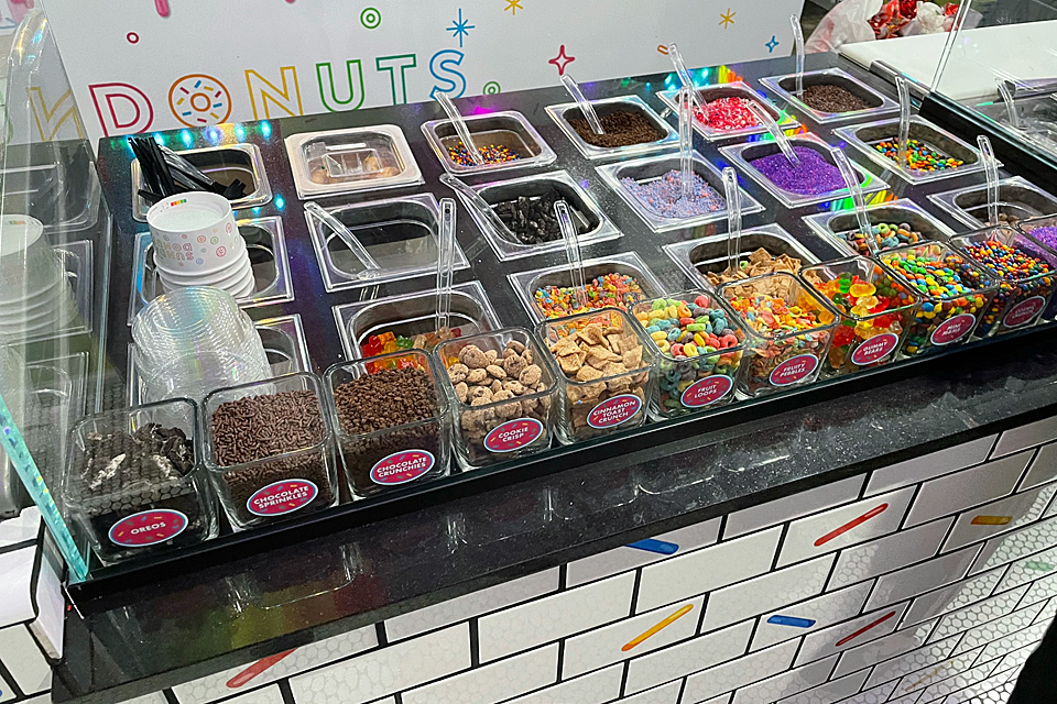 An epic toppings bar allows for an endless combination of sugar-filled treats at Sundae Donuts, Huntington's newest sweet shop. 