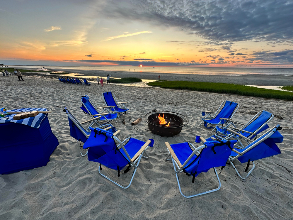 Enjoy s'mores at a fire pit on the private beach as the sun sets!