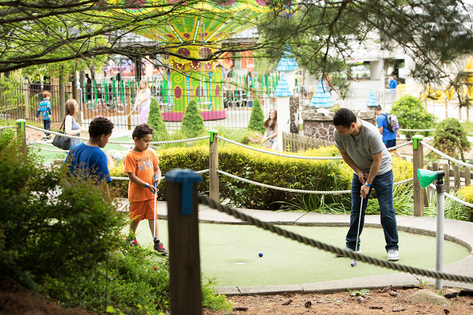 Enjoy some quality family time at the Castle Fun Center's mini-golf course.