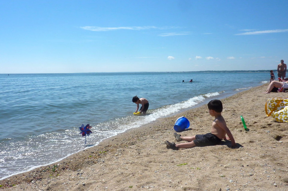 Kids wait for the tide to go out for critter catching at Hammonasset Beach State Park.  