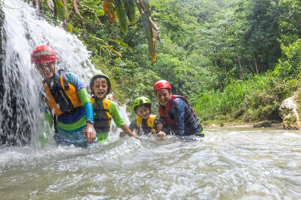 Explore cave systems of Puerto Rico while swimming and floating in turquoise fresh water. Photo courtesy of Discover Puerto Rico 