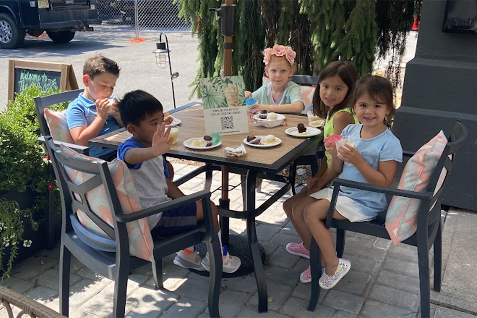 Kids gather around a table at The Compound Coffee Co. in Verona, New Jersey