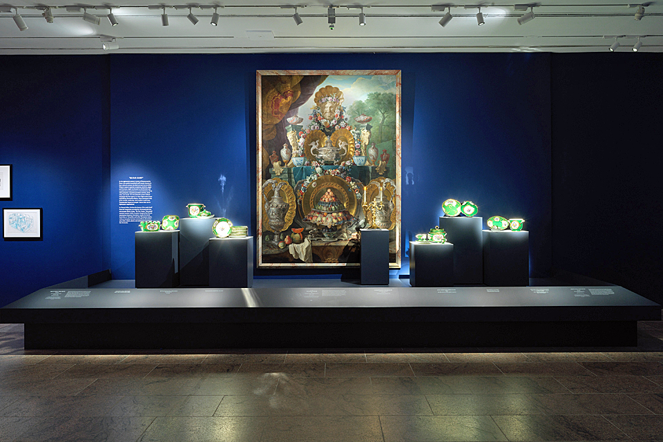 Porcelain and painting illustrating Beauty and the Beast's Be Our Guest Scene on view at Inspiring Walt Disney