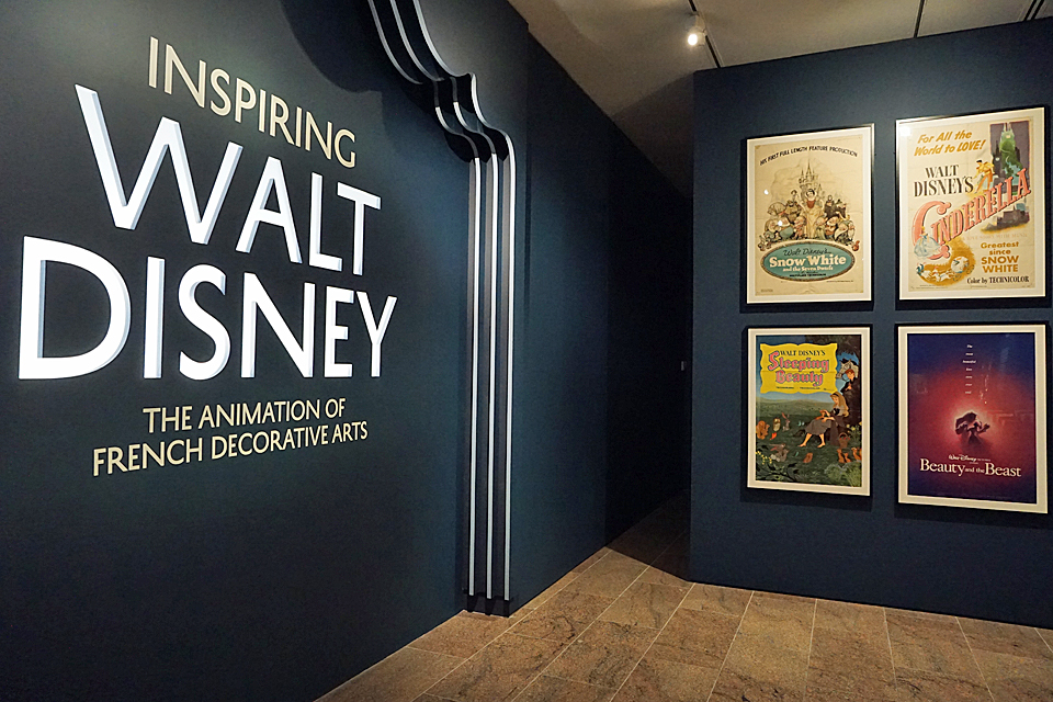 Inspiring Walt Disney displays Disney promo posters on the walls of The Met