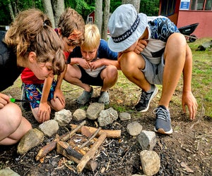 Campers learn survival skills at Eden Village Camp. Photo courtesy of the camp