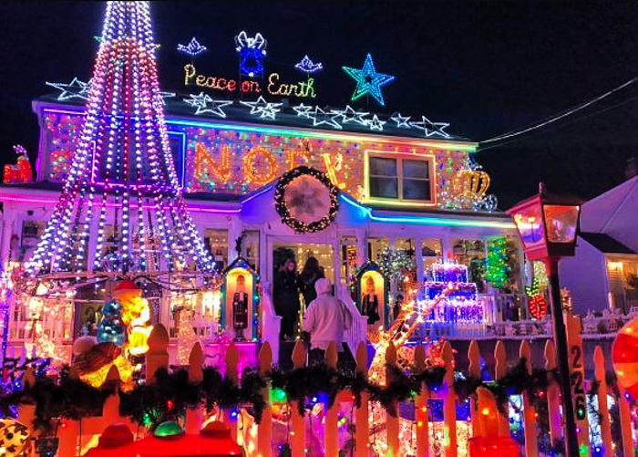 Photo of house covered in holiday lights - Best Neighborhood Christmas Light Displays