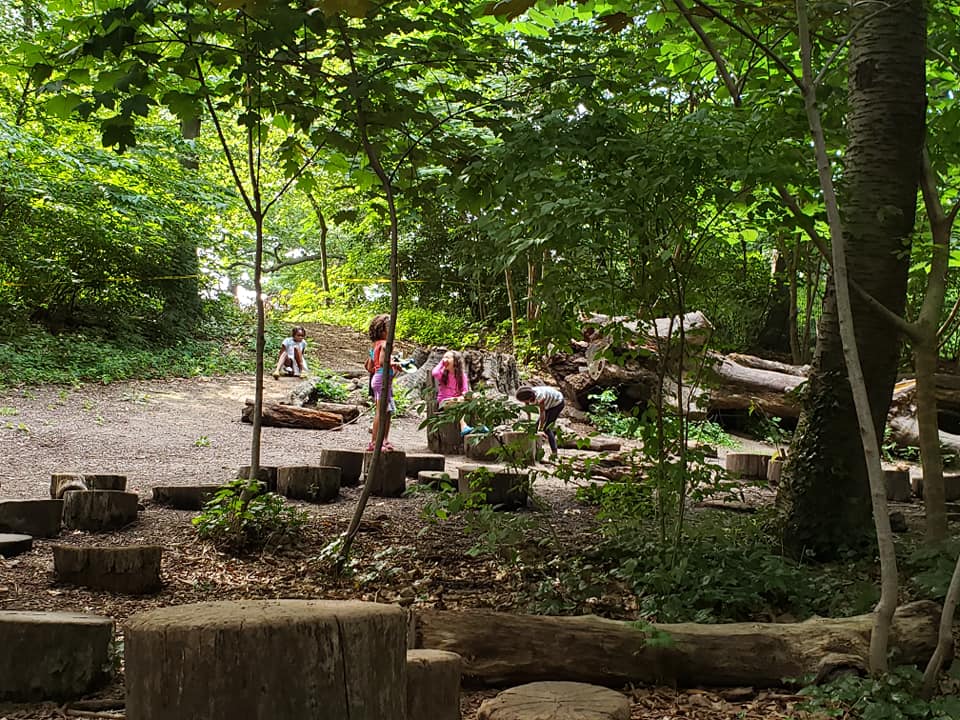 Children play at the Zucker Natural Exploration Area